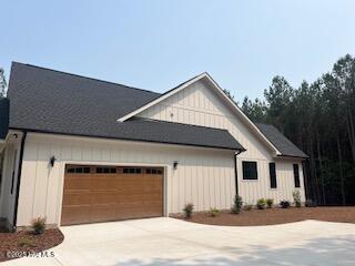 130 Gails Road West End, NC 27376 - Photo 5 of 61 Side entrance garage & turn-around pad