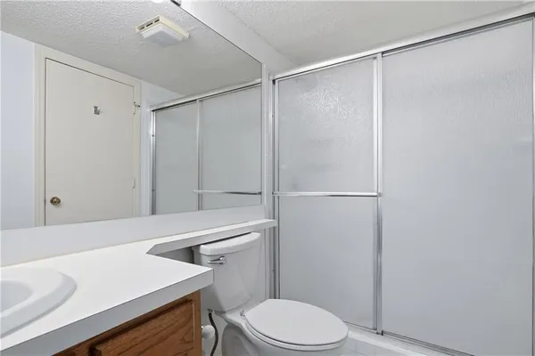 a view of a bathroom with a glass door