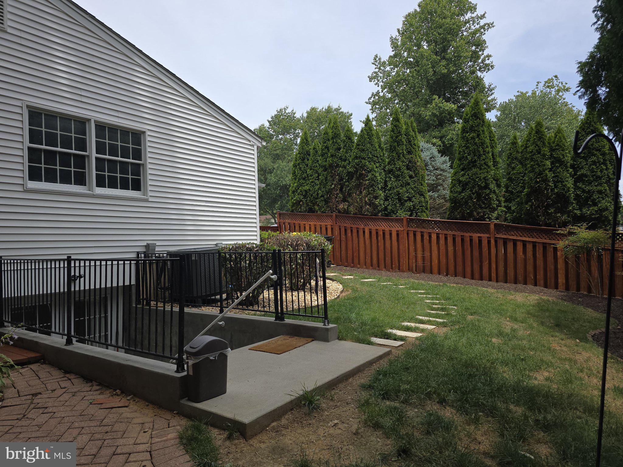 9201 Beachway Lane Springfield, VA 22153 - Photo 9 of 12 Serene backyard retreat with greenery.