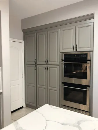 a kitchen with a stove and a microwave