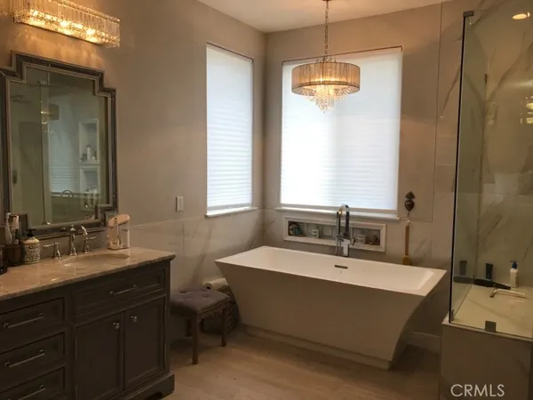 a bathroom with a double vanity sink and a mirror