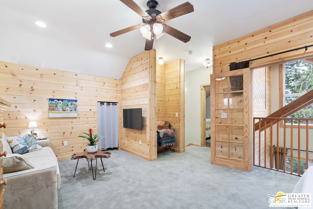52352 Pine Ridge Road Idyllwild, CA 92549 - Photo 26 of 73 a living room with furniture and a flat screen tv