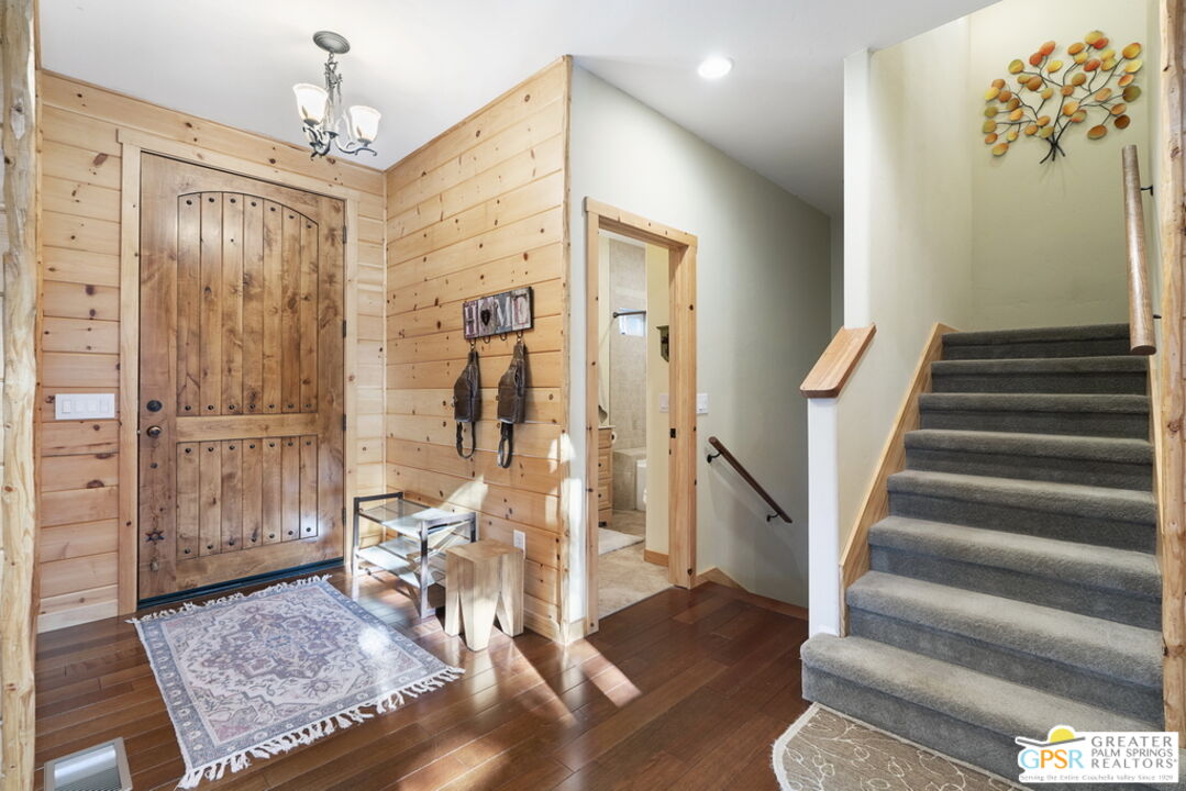 52352 Pine Ridge Road Idyllwild, CA 92549 - Photo 10 of 73 a view of a hallway with wooden floor and staircase
