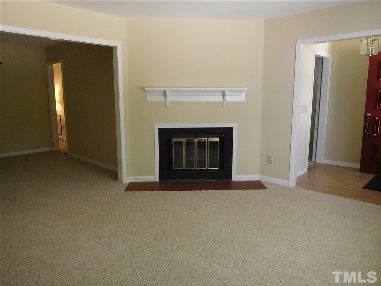 703 Tan Tara Square Raleigh, NC 27615 - Photo 3 of 21 Fresh paint throughout and brand new carpet. Wood burning fireplace.