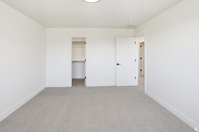 1315 West 3200 South, Unit 17 Perry, UT 84302 - Photo 42 of 58 Carpeted room featuring a ceiling-mounted light fixture, white walls, and white trim