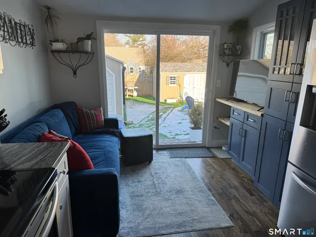 a view of bedroom with a bed and wooden floor