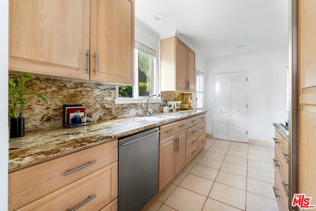 3381 Colbert Avenue Los Angeles, CA 90066 - Photo 11 of 24 a kitchen with stainless steel appliances granite countertop a sink and a stove