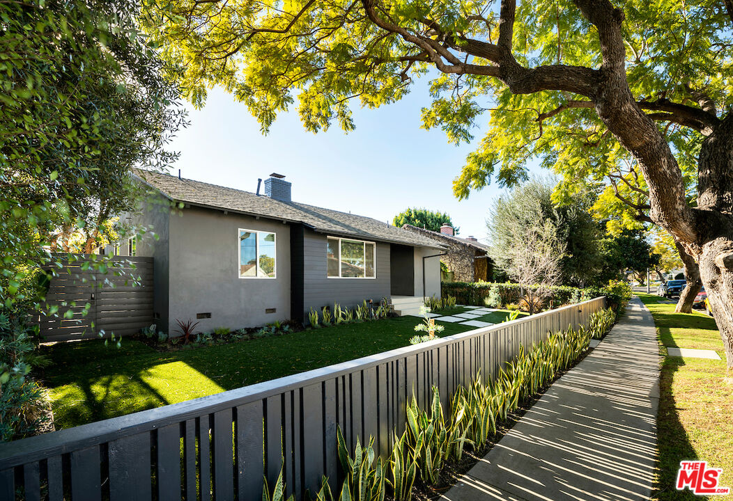 3381 Colbert Avenue Los Angeles, CA 90066 - Photo 2 of 24 a view of a house with wooden fence next to a yard