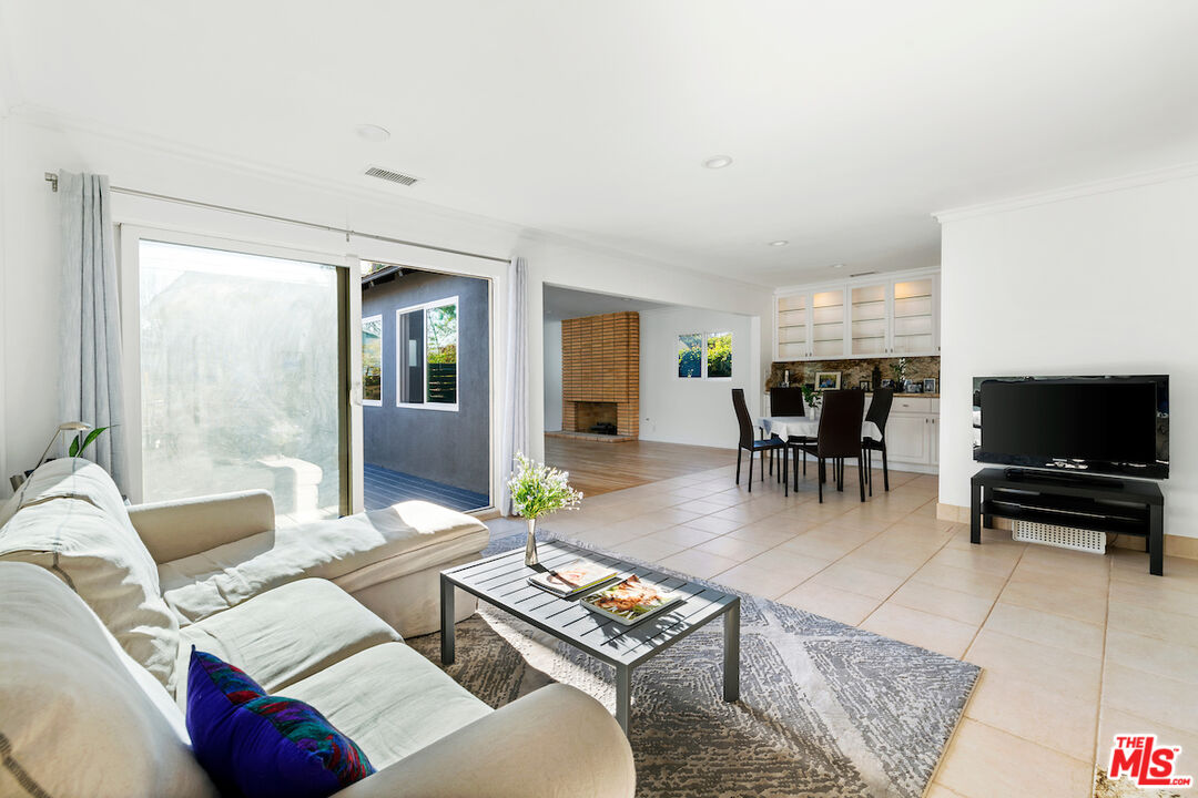 3381 Colbert Avenue Los Angeles, CA 90066 - Photo 6 of 24 a living room with furniture and a flat screen tv
