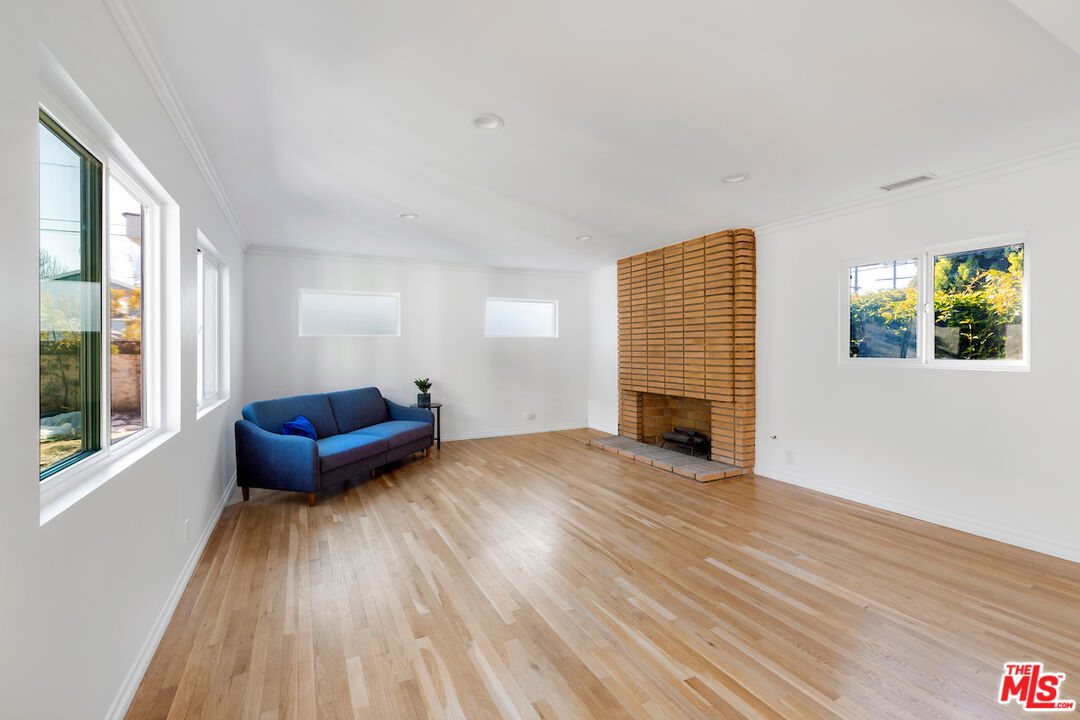 3381 Colbert Avenue Los Angeles, CA 90066 - Photo 9 of 24 a living room with furniture and a fireplace