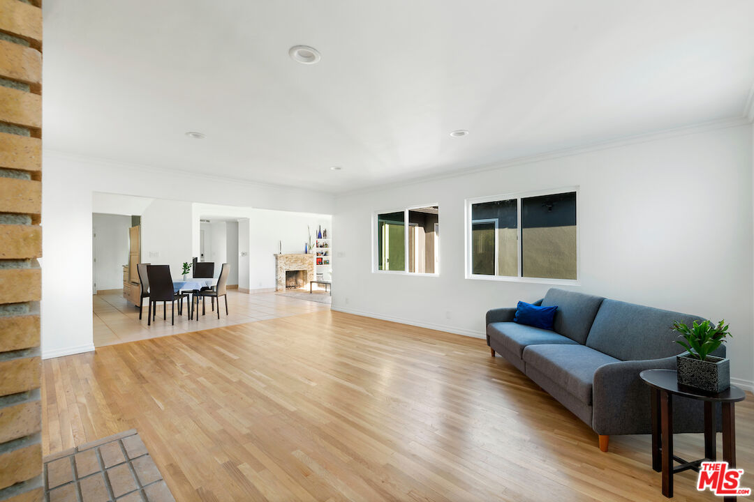 3381 Colbert Avenue Los Angeles, CA 90066 - Photo 10 of 24 a living room with furniture and wooden floor