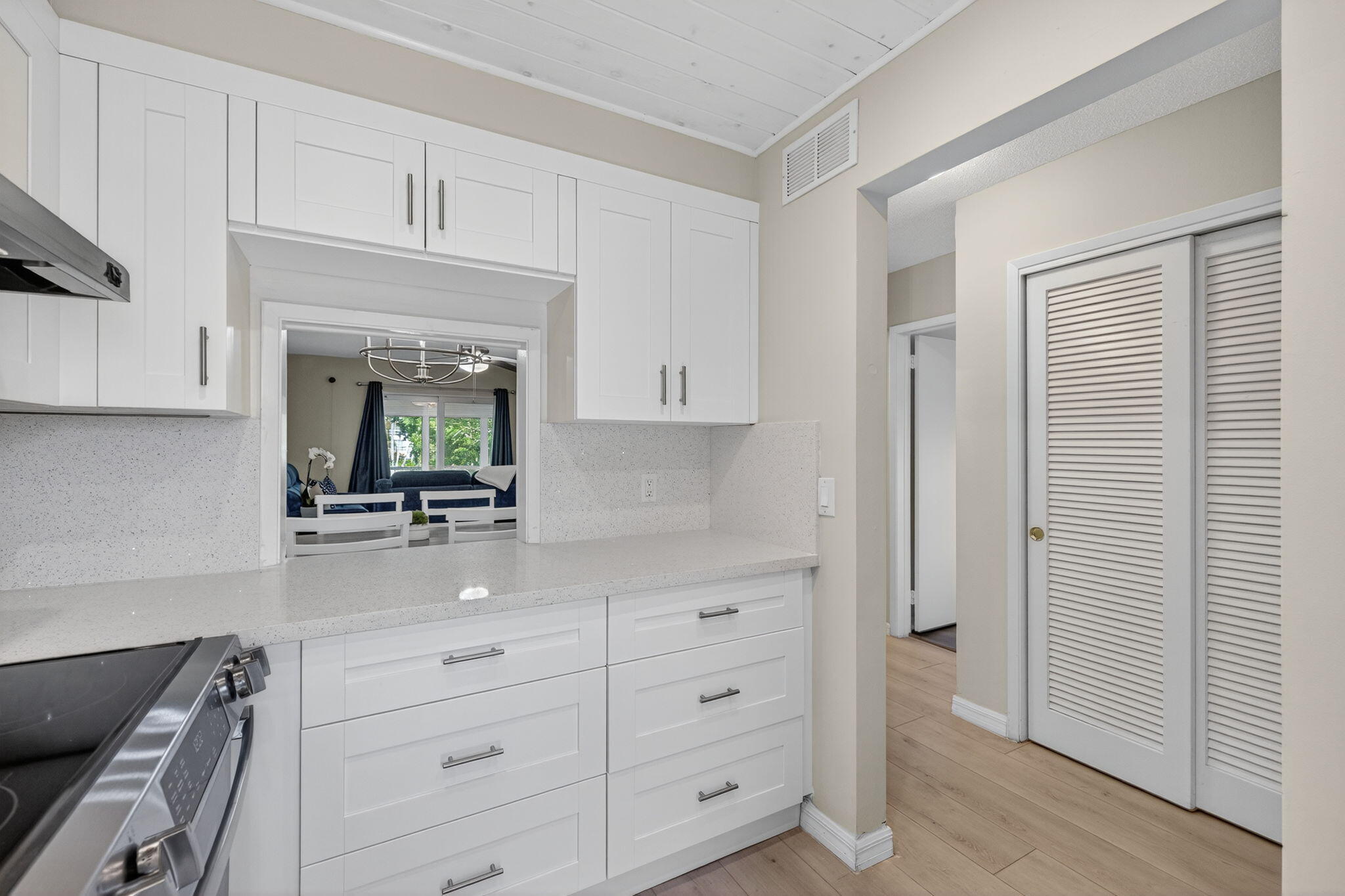 2050 Northeast 39th Street, Unit S210 Lighthouse Point, FL 33064 - Photo 16 of 46 a kitchen with white cabinets and appliances