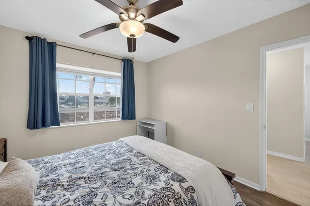 a bedroom with a bed and a window