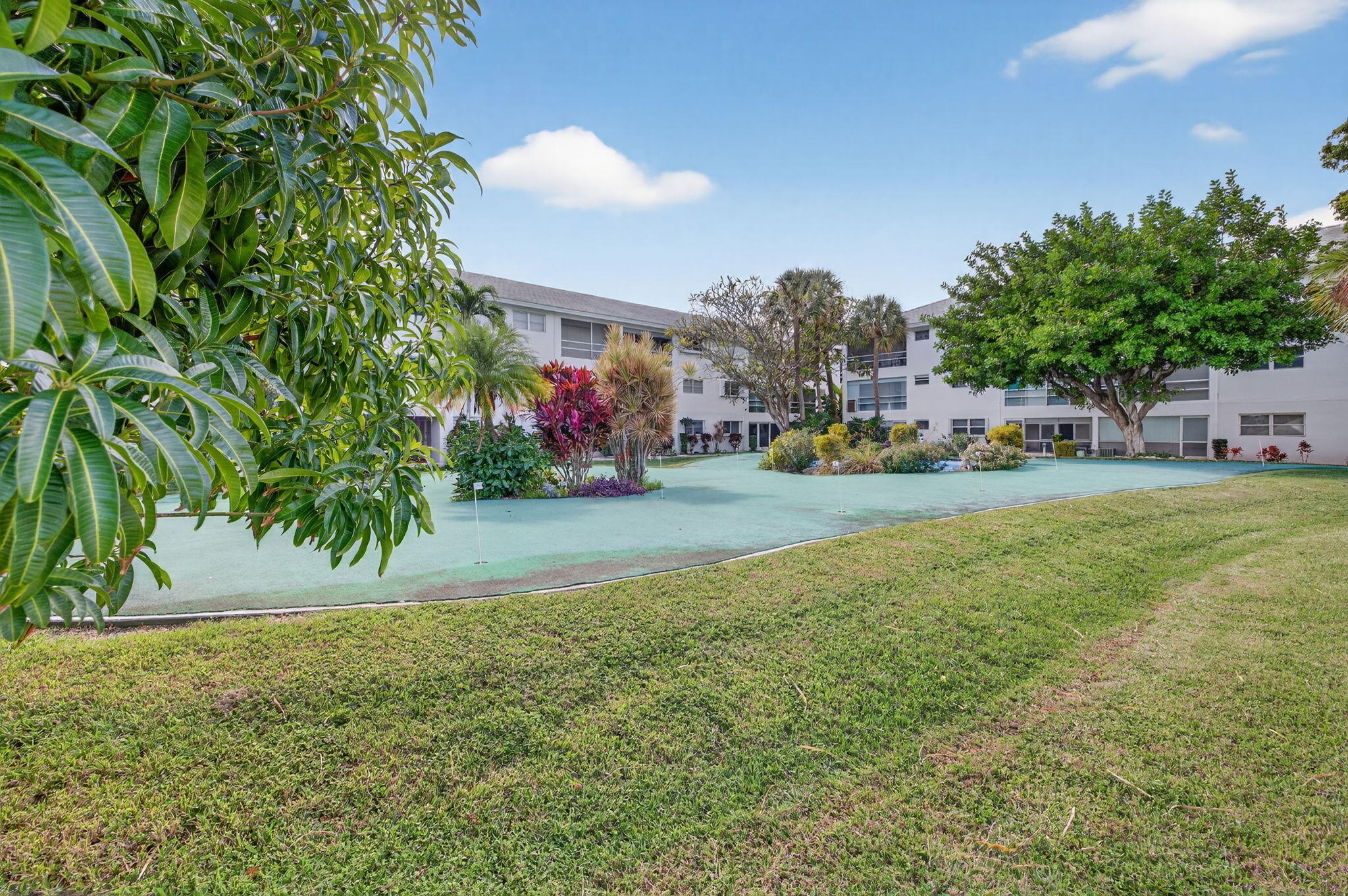 2050 Northeast 39th Street, Unit S210 Lighthouse Point, FL 33064 - Photo 40 of 46 a view of a street with a park