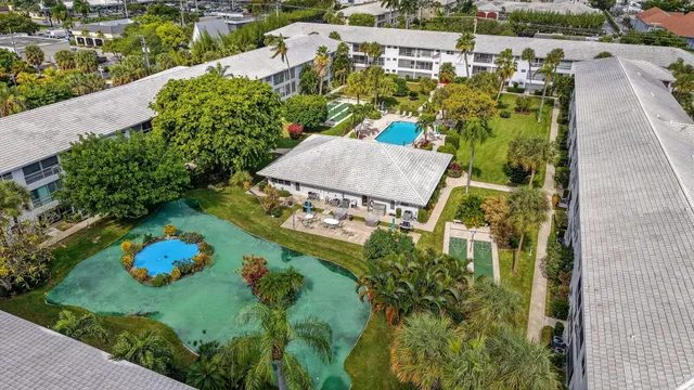 an aerial view of house with yard swimming pool and outdoor seating