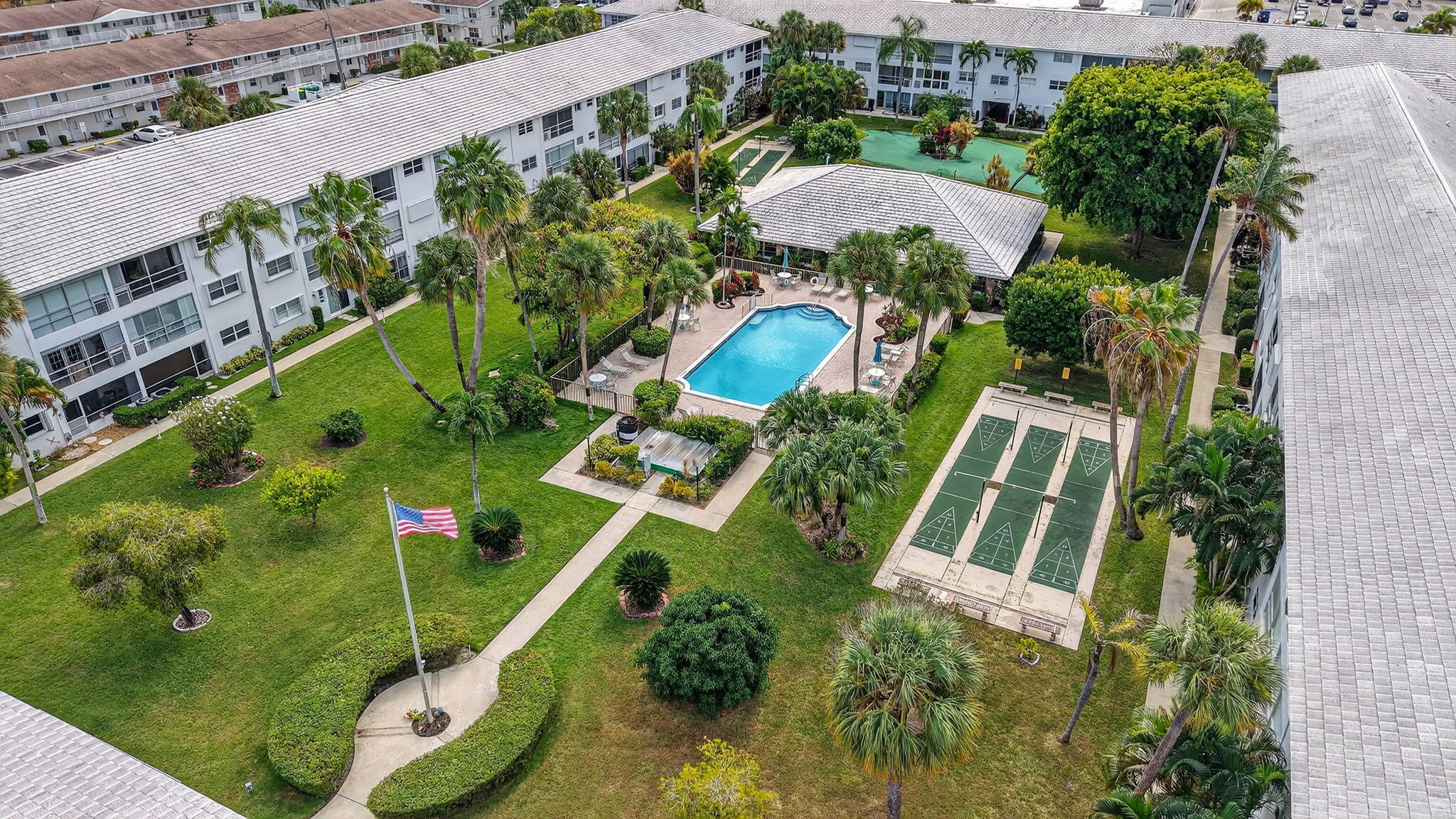 2050 Northeast 39th Street, Unit S210 Lighthouse Point, FL 33064 - Photo 43 of 46 an aerial view of house with yard swimming pool and outdoor seating