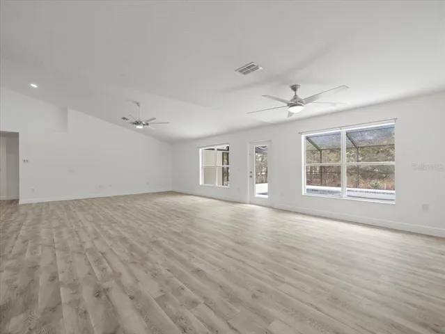 a kitchen with cabinets stainless steel appliances and a counter space