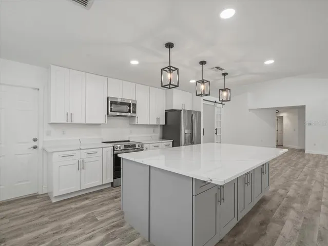 a kitchen with a stove and a sink