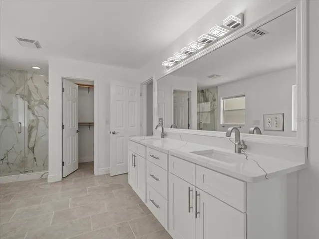 a white toilet sitting next to a shower