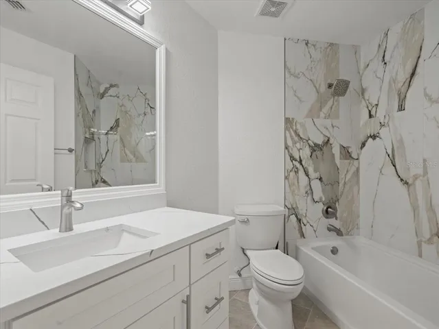 a view of an empty room with a balcony