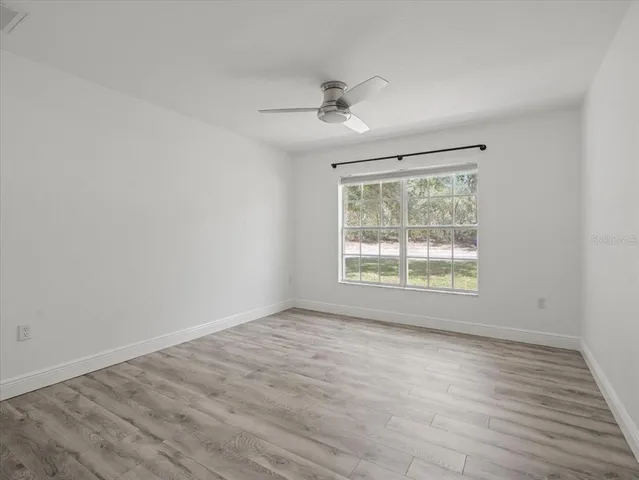 a view of a yard with swimming pool