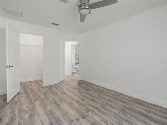an aerial view of a house with yard and outdoor seating
