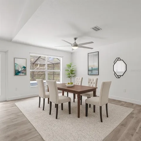 a large kitchen with stainless steel appliances kitchen island granite countertop a sink and cabinets