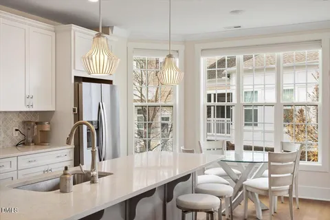 a kitchen with cabinets and window