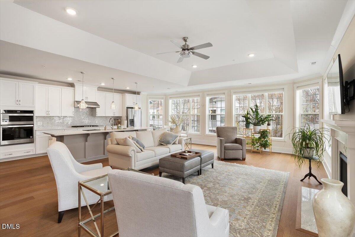 10530 Sablewood Drive, Unit 215 Raleigh, NC 27617 - Photo 20 of 40 a living room with furniture and a large window