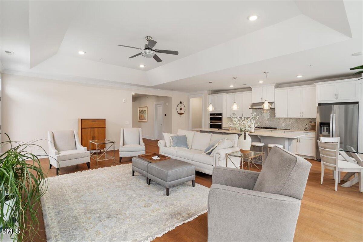 10530 Sablewood Drive, Unit 215 Raleigh, NC 27617 - Photo 22 of 40 a living room with furniture and kitchen view