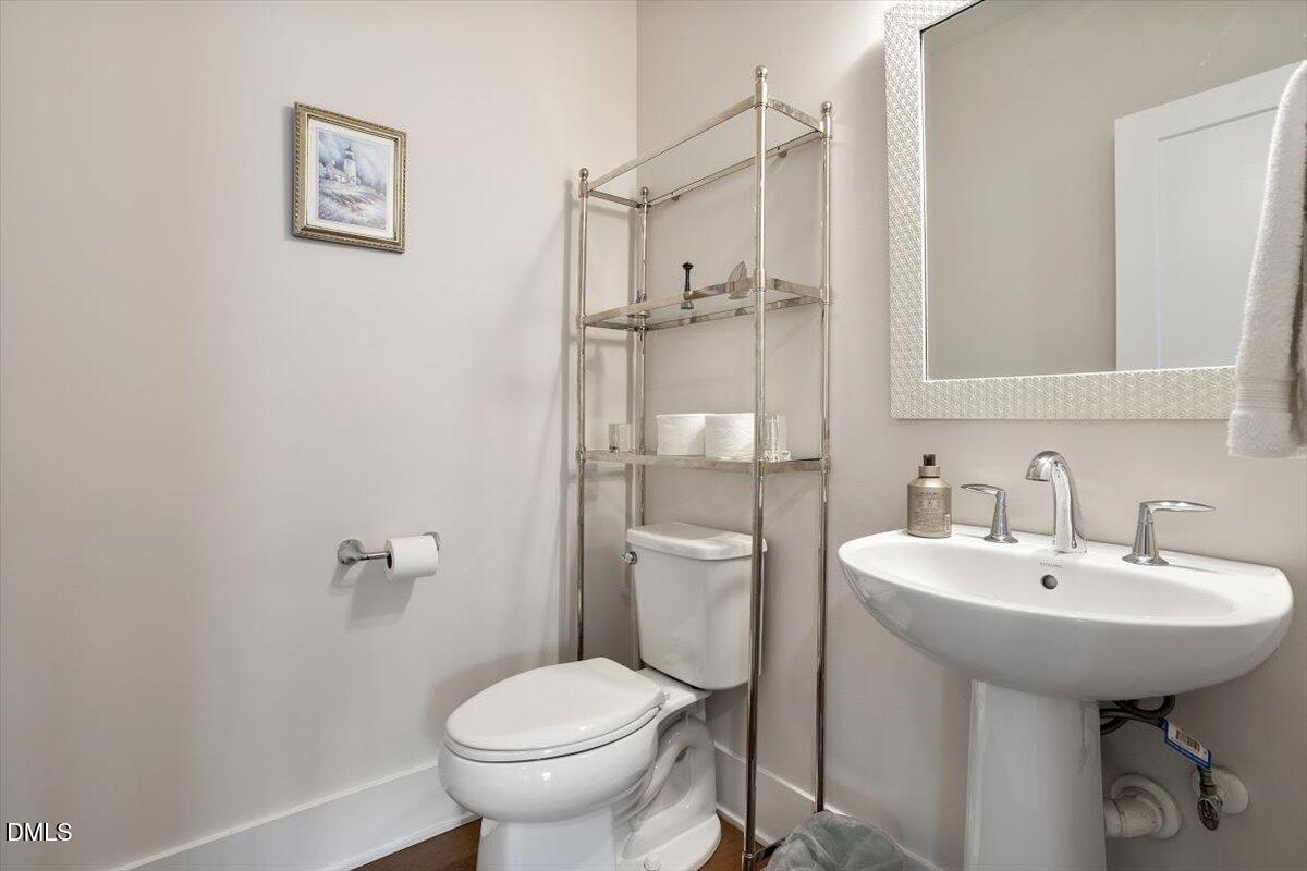 10530 Sablewood Drive, Unit 215 Raleigh, NC 27617 - Photo 25 of 40 a bathroom with a sink toilet and shower