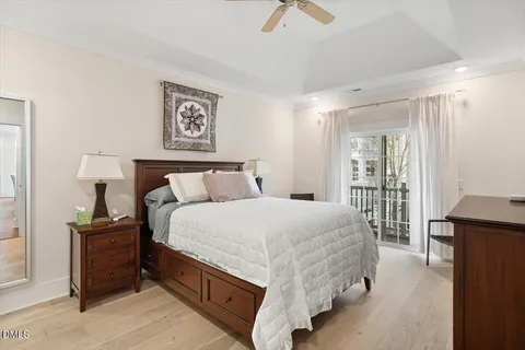 a bedroom with a bed and a lamp on table