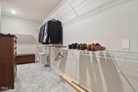 a utility room with cabinets washer and dryer