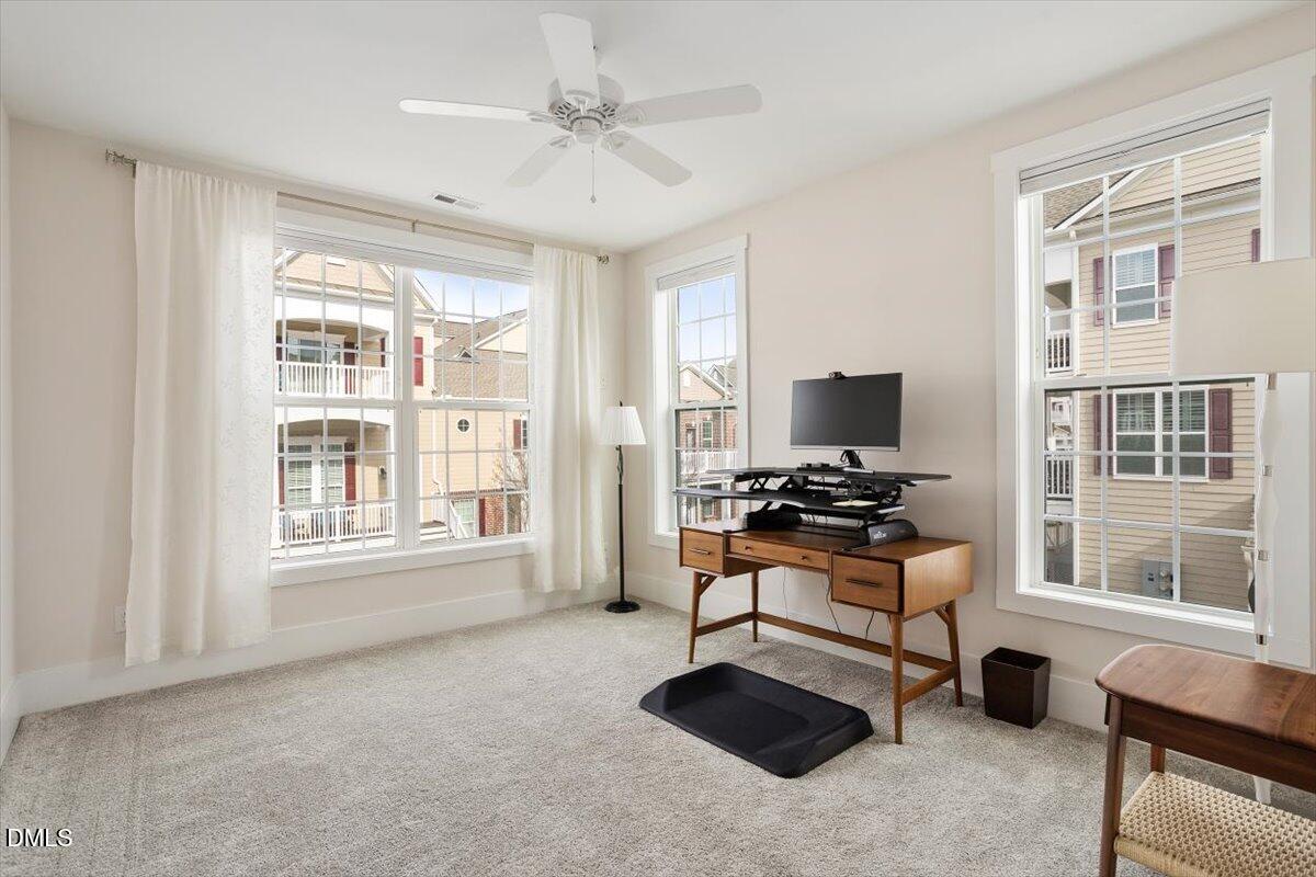 10530 Sablewood Drive, Unit 215 Raleigh, NC 27617 - Photo 33 of 40 a living room with furniture and a window