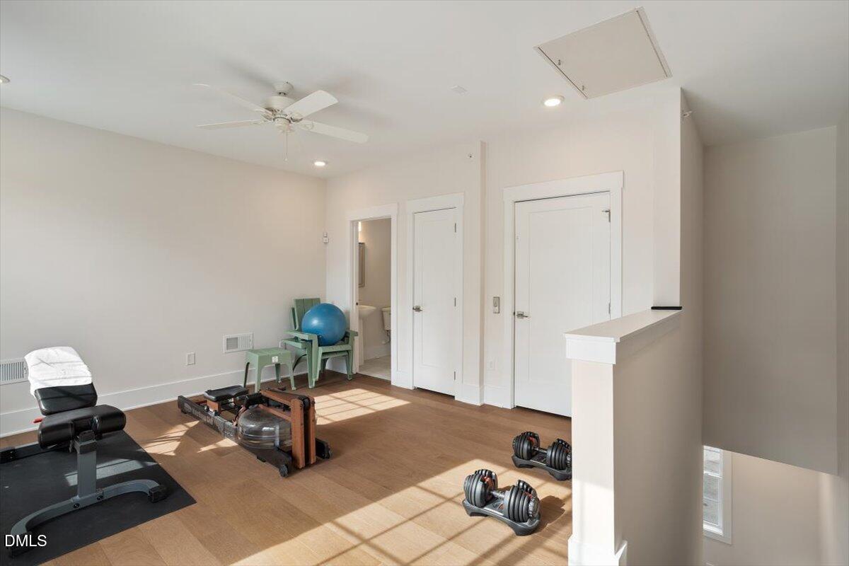 10530 Sablewood Drive, Unit 215 Raleigh, NC 27617 - Photo 37 of 40 a living room with furniture and a chandelier