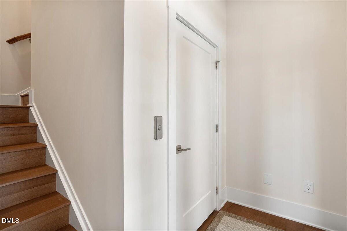 10530 Sablewood Drive, Unit 215 Raleigh, NC 27617 - Photo 5 of 40 a view of a hallway with wooden floor and entryway