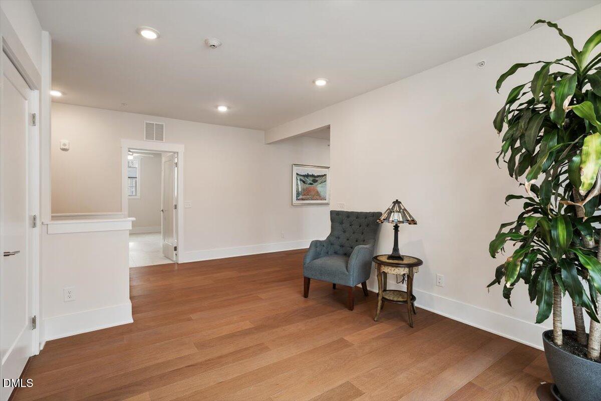 10530 Sablewood Drive, Unit 215 Raleigh, NC 27617 - Photo 7 of 40 a view of a livingroom with furniture and a potted plant