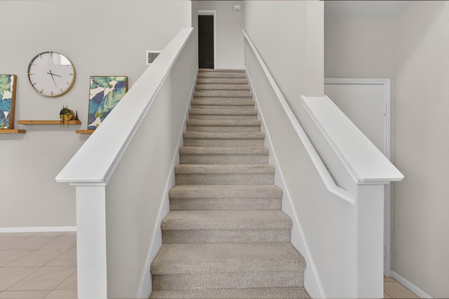 2006 Grow Lane Austin, TX 78754 - Photo 5 of 40 Ascend to comfort on this carpeted staircase, connecting living spaces with ease.