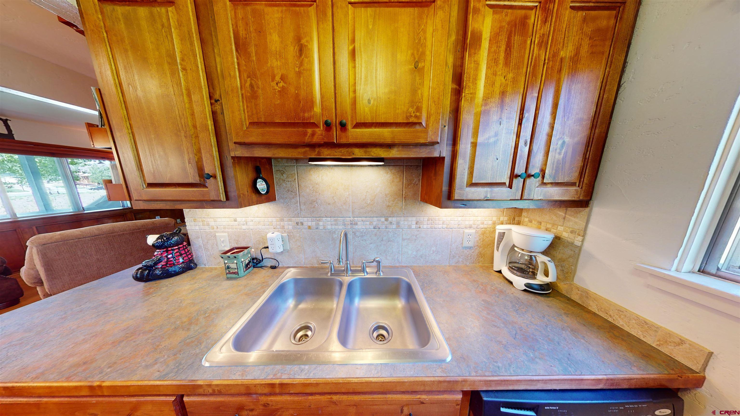 18 Crystal Road, Unit 3B Crested Butte, CO 81225 - Photo 11 of 20 a kitchen with a sink cabinets and a window