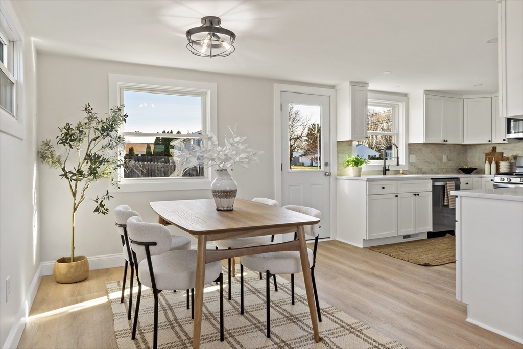 602 Regan Road Somerset, MA 02726 - Photo 11 of 35 a kitchen with a table and chairs in it