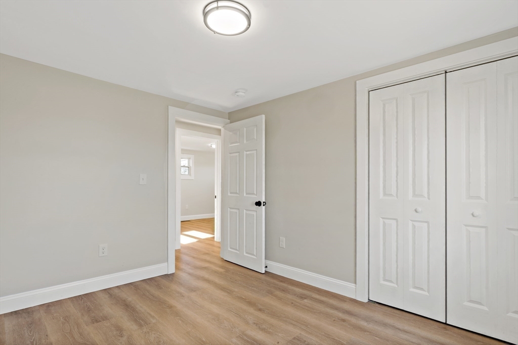 602 Regan Road Somerset, MA 02726 - Photo 20 of 35 a view of an empty room and wooden floor