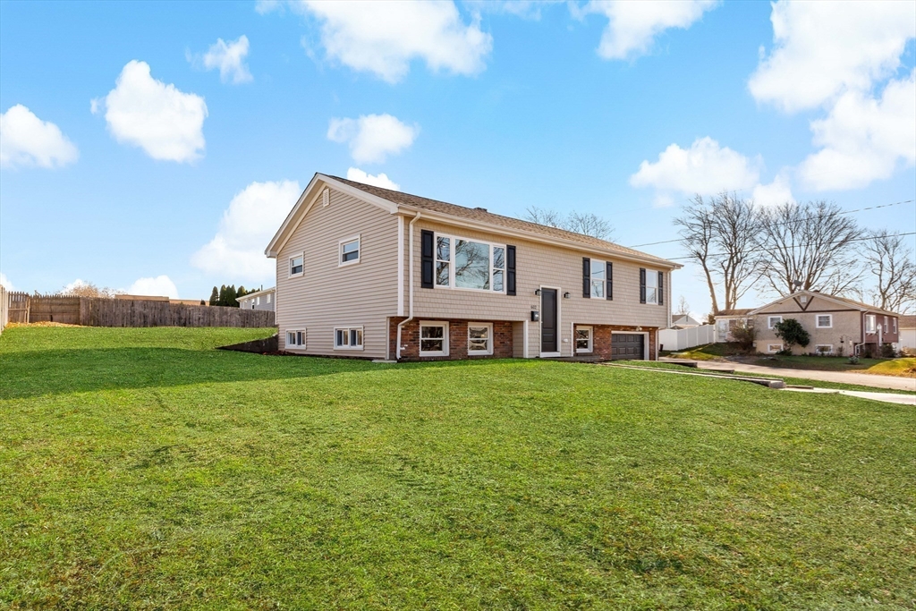 602 Regan Road Somerset, MA 02726 - Photo 3 of 35 a house view with a garden space