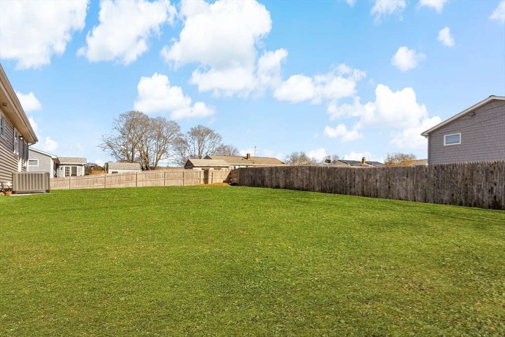 602 Regan Road Somerset, MA 02726 - Photo 33 of 35 a view of a field of grass and trees