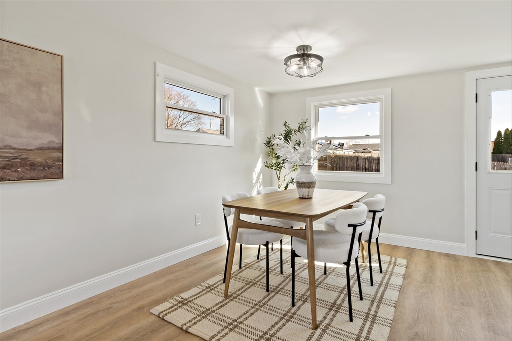 602 Regan Road Somerset, MA 02726 - Photo 10 of 35 a view of a dining room with furniture and wooden floor