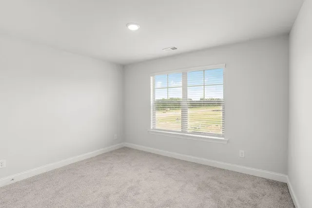 an empty room with a bathroom
