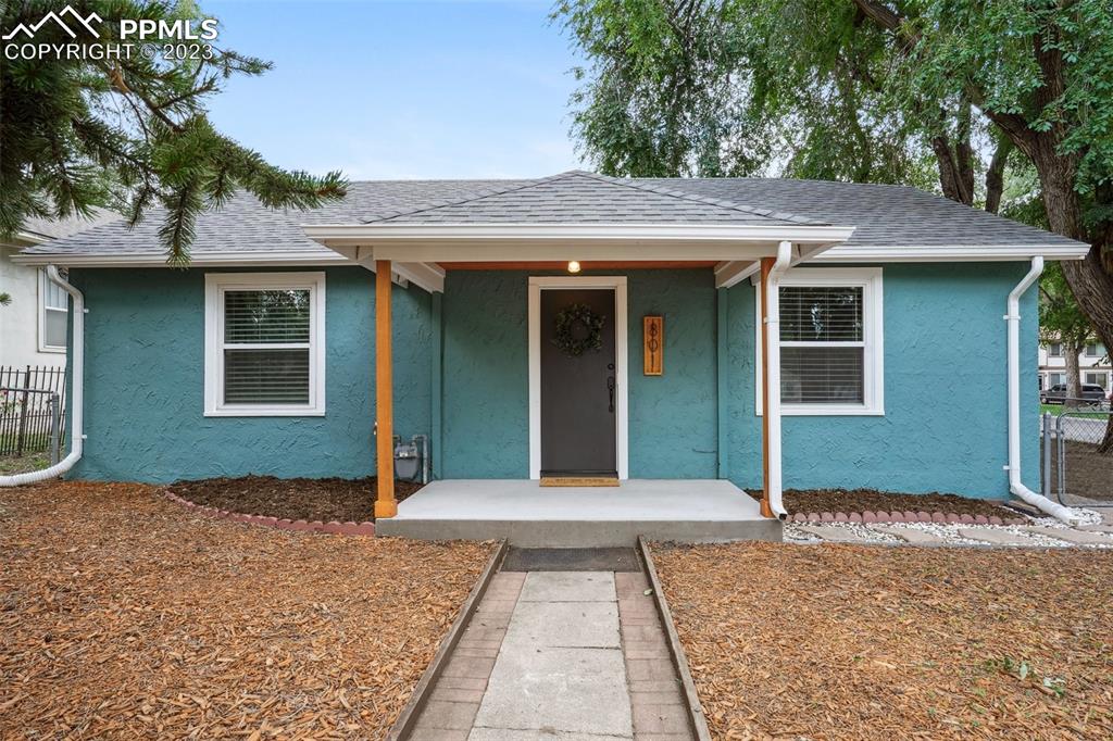 801 Alexander Road Colorado Springs, CO 80909 - Photo 1 of 23 a front view of a house