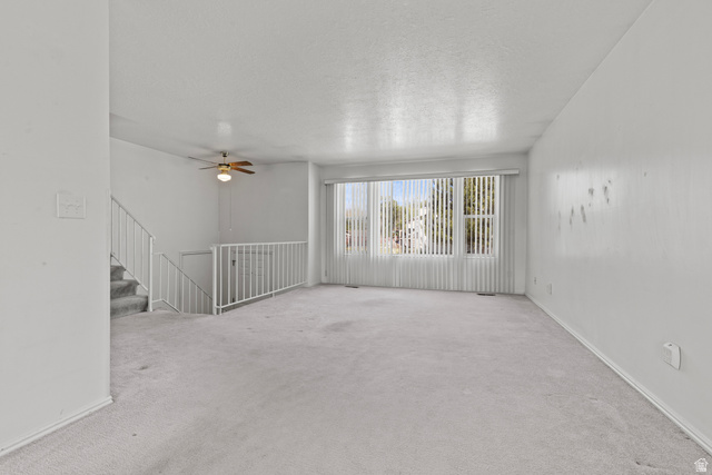 5643 South 2950th Street West Roy, UT 84067 - Photo 3 of 12 Large main floor family room to enjoy mountain view