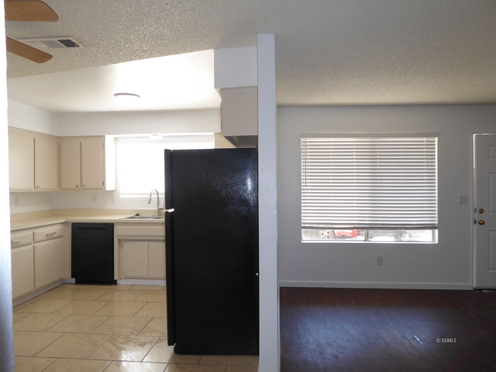 824 C Capehart Court Ridgecrest, CA 93555 - Photo 4 of 11 a kitchen with a refrigerator and a sink