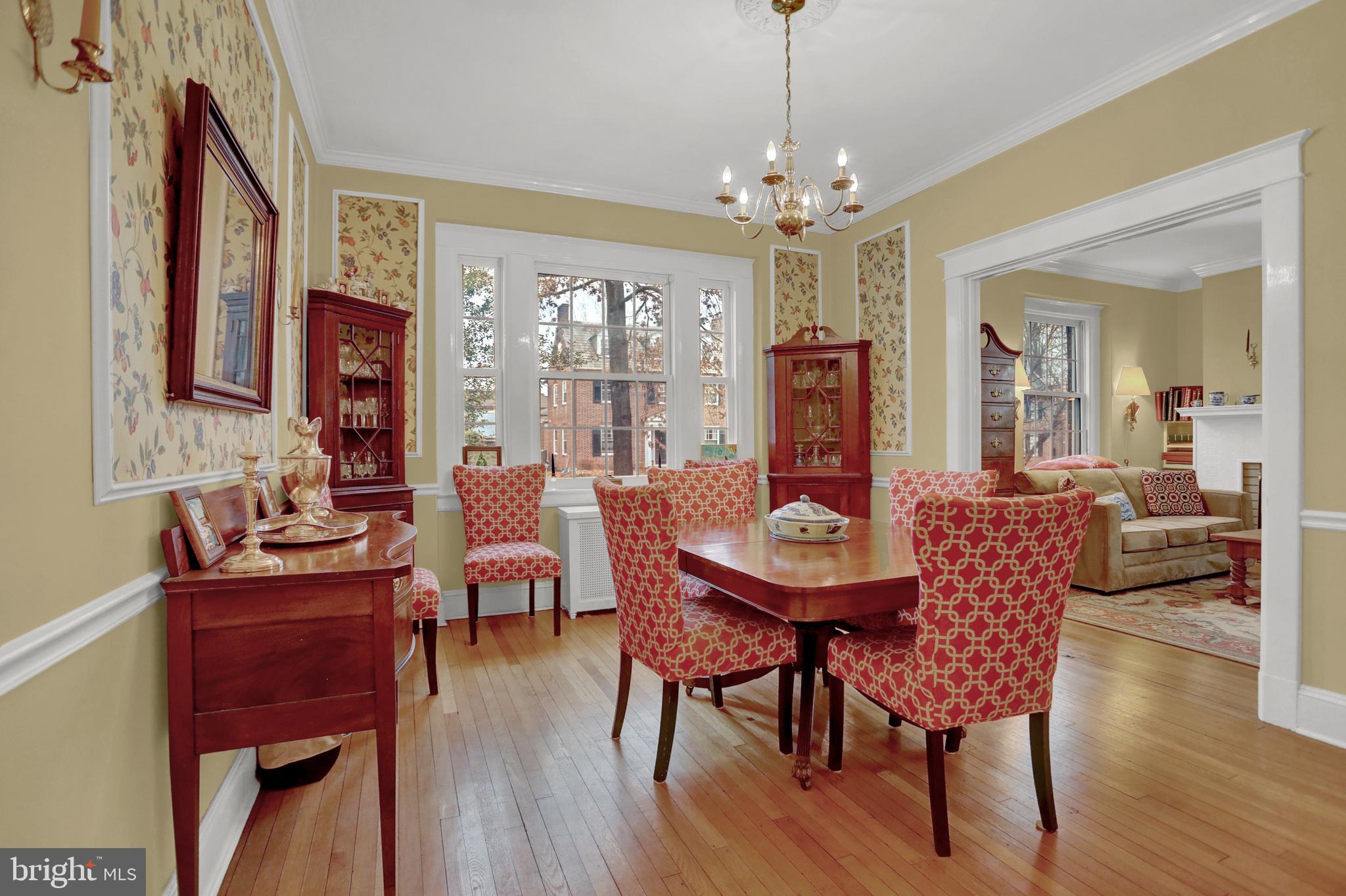 607 Somerset Road, Unit 2 Baltimore, MD 21210 - Photo 3 of 23 a view of a dining room with furniture wooden floor and chandelier