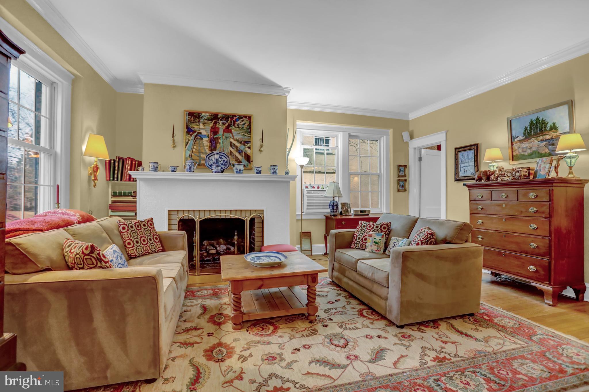 607 Somerset Road, Unit 2 Baltimore, MD 21210 - Photo 7 of 23 a living room with furniture and a fireplace